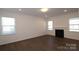 Spacious living room with hardwood floors and a fireplace at 8224 Annsborough Nw Dr, Concord, NC 28027