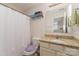 Clean bathroom with single vanity and shower/tub combo at 8411 Washoe Pine Ln, Charlotte, NC 28215