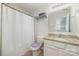 Bright bathroom featuring a marble vanity, large mirror and shower at 8411 Washoe Pine Ln, Charlotte, NC 28215