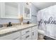 Bathroom with a double sink vanity, granite counters and unique shower curtain at 8411 Washoe Pine Ln, Charlotte, NC 28215