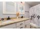 Double vanity bathroom with granite countertop and modern fixtures at 8411 Washoe Pine Ln, Charlotte, NC 28215