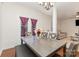 Dining room with gray table and chairs, view to living room at 8411 Washoe Pine Ln, Charlotte, NC 28215