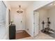 Bright entryway with hardwood floors and access to home gym at 8411 Washoe Pine Ln, Charlotte, NC 28215