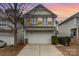 Two-story house with a garage and front yard at 8411 Washoe Pine Ln, Charlotte, NC 28215