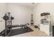 Gym features workout equipment, weight bench and storage shelf at 8411 Washoe Pine Ln, Charlotte, NC 28215