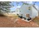 Exterior view of the house with a patio and backyard at 8411 Washoe Pine Ln, Charlotte, NC 28215