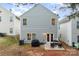 Exterior view of the house with a patio and backyard at 8411 Washoe Pine Ln, Charlotte, NC 28215