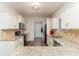 Modern kitchen with granite countertops and white cabinets at 8411 Washoe Pine Ln, Charlotte, NC 28215