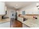 Modern kitchen with granite countertops and white cabinets at 8411 Washoe Pine Ln, Charlotte, NC 28215