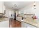 Well-lit kitchen featuring granite countertops, stainless steel appliances, and ample cabinet space at 8411 Washoe Pine Ln, Charlotte, NC 28215