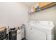 Laundry room with washer, dryer, shelf and laundry baskets at 8411 Washoe Pine Ln, Charlotte, NC 28215