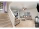 Spacious living room with carpeted floors and stairs at 8411 Washoe Pine Ln, Charlotte, NC 28215