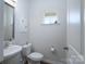 Clean half bathroom with modern mirror at 9015 Ramsford Ct, Mint Hill, NC 28227