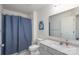 Bathroom with shower, tub, vanity, and blue shower curtain at 9015 Ramsford Ct, Mint Hill, NC 28227