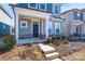 Inviting front porch with stone accents and a stylish entrance door at 9015 Ramsford Ct, Mint Hill, NC 28227