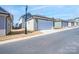 Street view of attached garages, highlighting their convenient access and modern design at 9015 Ramsford Ct, Mint Hill, NC 28227