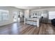 Modern eat-in kitchen featuring an island with seating and stainless steel appliances at 9015 Ramsford Ct, Mint Hill, NC 28227