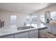 Bright kitchen featuring white granite countertops and stainless steel appliances at 9015 Ramsford Ct, Mint Hill, NC 28227