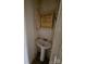 Small bathroom with pedestal sink, medicine cabinet, and toilet at 905 Saluda St, Rock Hill, SC 29730