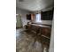 Kitchen with double sink and brown wooden cabinets at 905 Saluda St, Rock Hill, SC 29730