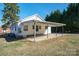 View of the backyard, carport, and back of the home at 105 W 21St St, Kannapolis, NC 28081