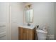 Stylish bathroom with updated vanity, modern mirror, and a classic white toilet at 105 W 21St St, Kannapolis, NC 28081