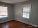 Bedroom with hardwood floors and window with awning at 105 W 21St St, Kannapolis, NC 28081