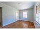 Sunlit bedroom with hardwood floors, offering a blank canvas for personalization at 105 W 21St St, Kannapolis, NC 28081