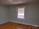 Bright bedroom with hardwood floors and window at 105 W 21St St, Kannapolis, NC 28081