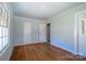 Spacious bedroom with hardwood floors, multiple doorways and windows at 105 W 21St St, Kannapolis, NC 28081