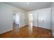 Spacious bedroom with hardwood floors, white trim, and multiple doors at 105 W 21St St, Kannapolis, NC 28081