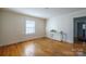 Bright and airy bedroom featuring hardwood floors, natural light, and a neutral color palette at 105 W 21St St, Kannapolis, NC 28081