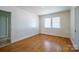 Well-lit bedroom with hardwood floors, ideal for creating a comfortable living space at 105 W 21St St, Kannapolis, NC 28081