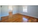 Bedroom featuring hardwood floors, a window, and neutral-colored walls at 105 W 21St St, Kannapolis, NC 28081