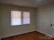 Bedroom with hardwood floors and two windows at 105 W 21St St, Kannapolis, NC 28081