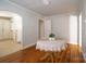 Inviting dining room area featuring hardwood floors, a classic round table, and access to other rooms at 105 W 21St St, Kannapolis, NC 28081