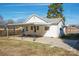 A backyard view of the home with a carport at 105 W 21St St, Kannapolis, NC 28081