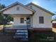 Charming white house with a front porch and brick steps at 105 W 21St St, Kannapolis, NC 28081