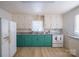 This beautiful kitchen features spacious countertops and ample natural light at 105 W 21St St, Kannapolis, NC 28081