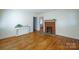 Bright living room showcasing hardwood floors, fireplace with decorative mantel, and fresh paint at 105 W 21St St, Kannapolis, NC 28081