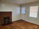 Living room with hardwood floors, fireplace and door at 105 W 21St St, Kannapolis, NC 28081