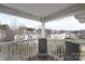 Relaxing balcony with seating and a view of the surrounding neighborhood and mature trees at 10628 Hill Point Ct, Charlotte, NC 28262