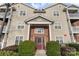 Attractive condo building with manicured landscaping, brick accents, and a welcoming entrance at 10628 Hill Point Ct, Charlotte, NC 28262