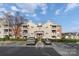 Multi-story condo with balconies, brick accents, and convenient parking in a well-maintained community at 10628 Hill Point Ct, Charlotte, NC 28262