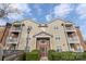 Exterior view of a multi-unit building with balconies, neat landscaping, and convenient access to parking at 10628 Hill Point Ct, Charlotte, NC 28262