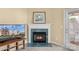 The fireplace provides a stunning focal point and an exit to a lovely balcony at 10628 Hill Point Ct, Charlotte, NC 28262