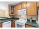 Modern condo kitchen featuring appliances, ample counter space, and plenty of storage cabinets at 10628 Hill Point Ct, Charlotte, NC 28262