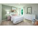 Bright bedroom featuring a queen-size bed and plenty of closet space at 10630 Tuff Ln, Davidson, NC 28036