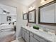 Bathroom featuring a double sink vanity with granite countertop at 11143 Coachman Cir, Charlotte, NC 28277