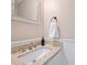 Bathroom featuring a neutral vanity with a granite countertop, a modern faucet, and a decorative mirror at 11143 Coachman Cir, Charlotte, NC 28277